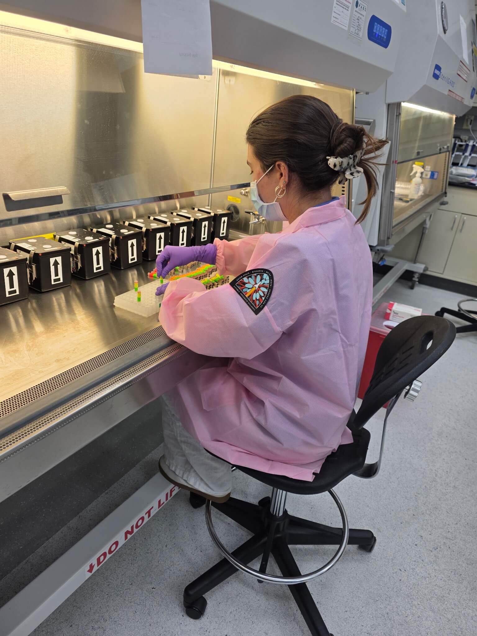 NSCF Research Associate Maria Balaguer loads cryovials containing Cosmic Organoid Villages™ into a rack in preparation for launch on SpaceX CRS-35. Photo Credit: National Stem Cell Foundation